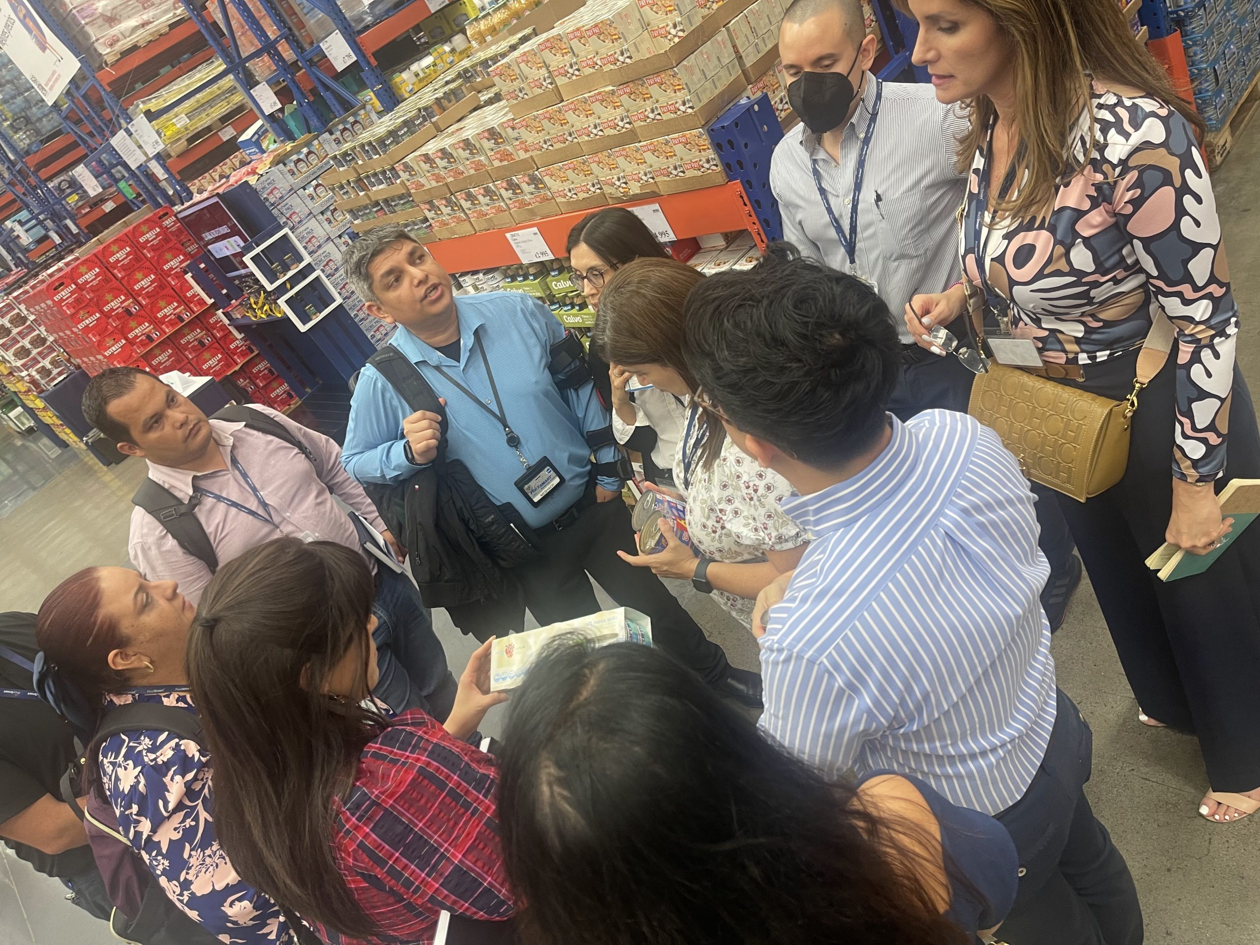 Group listening to tour guide at a PriceSmart Inc. Market