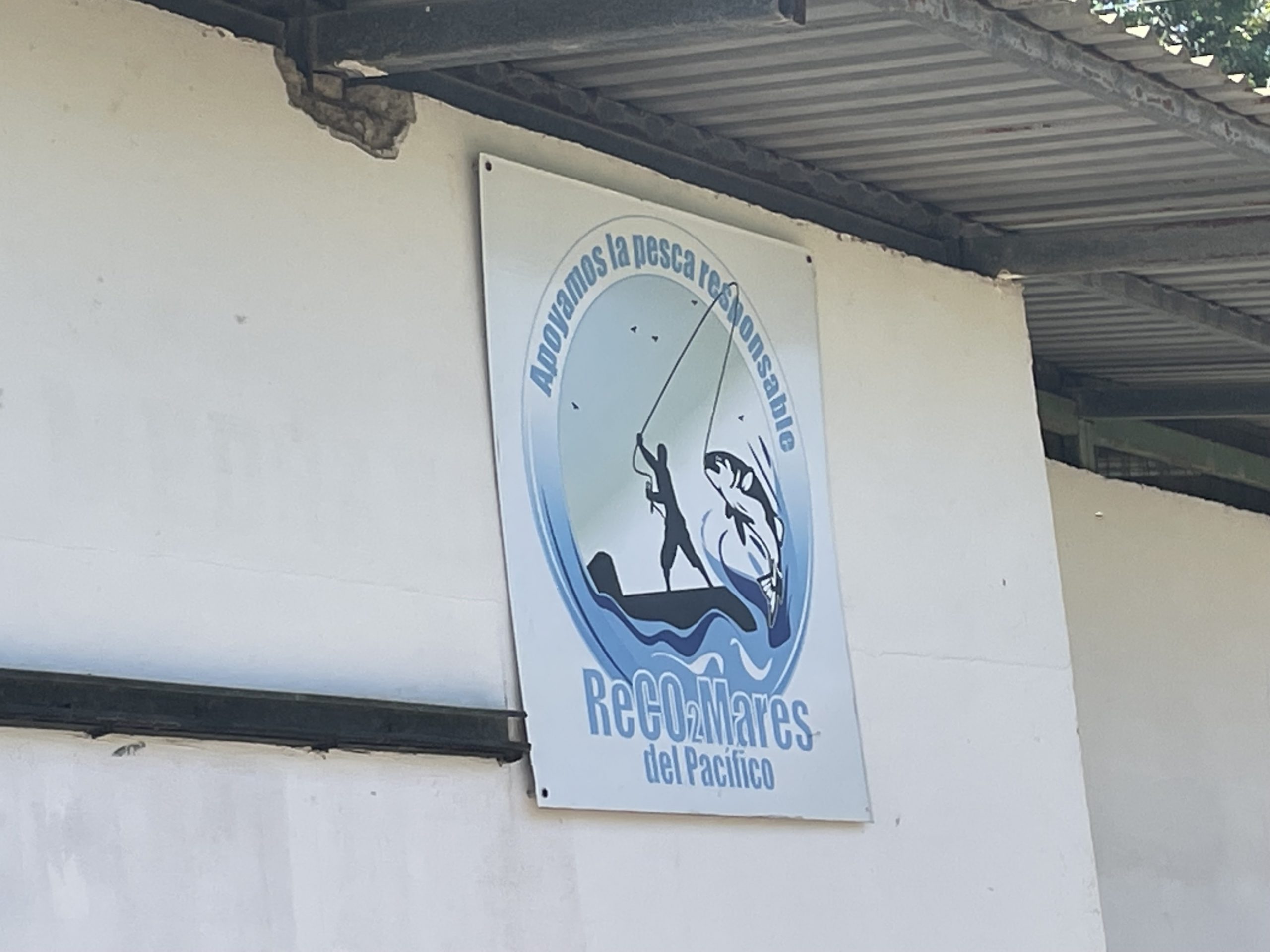 A sign showing a man fishing