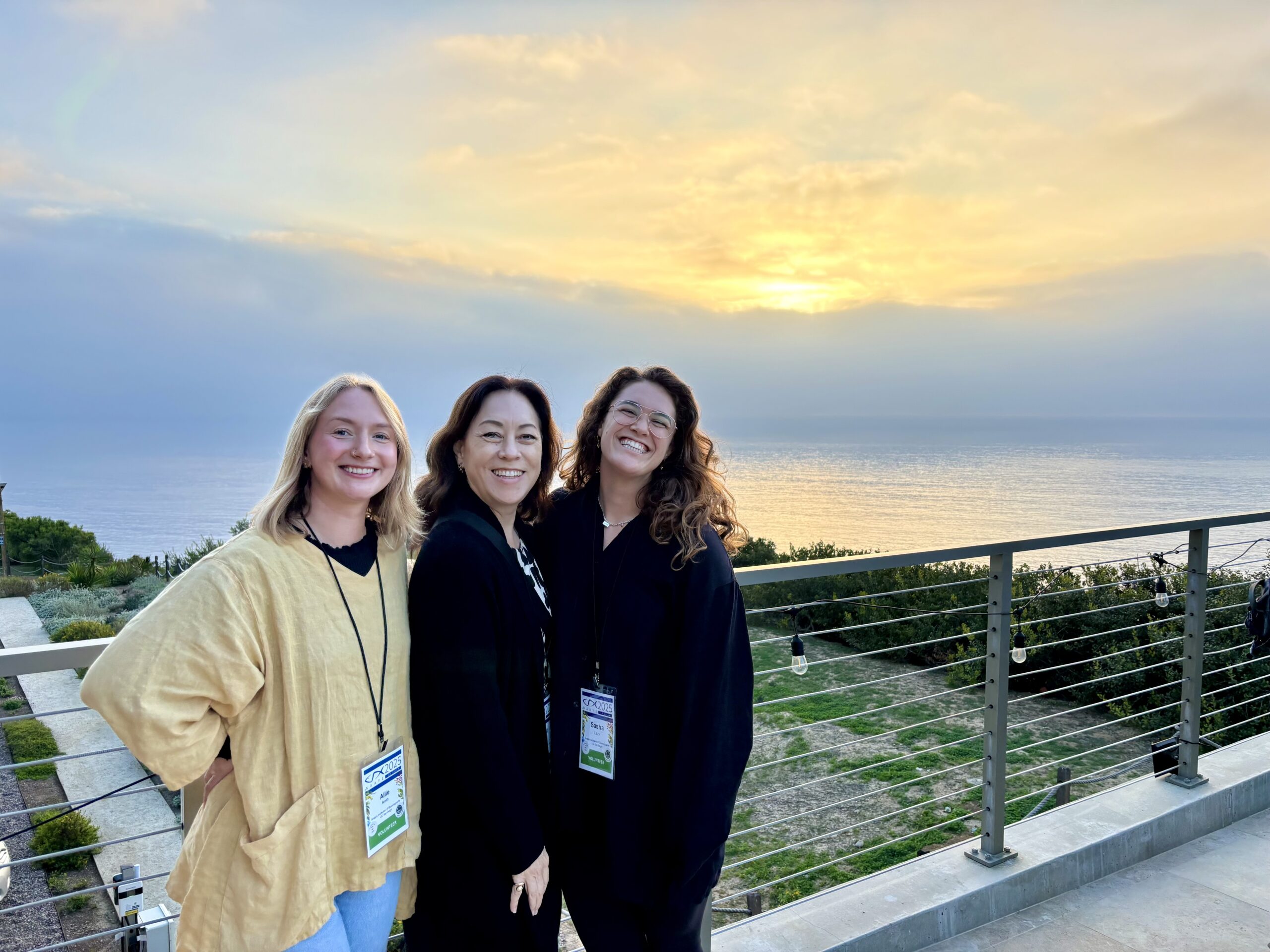 Volunteers watch the sunset during the Welcome Reception at MCTF.