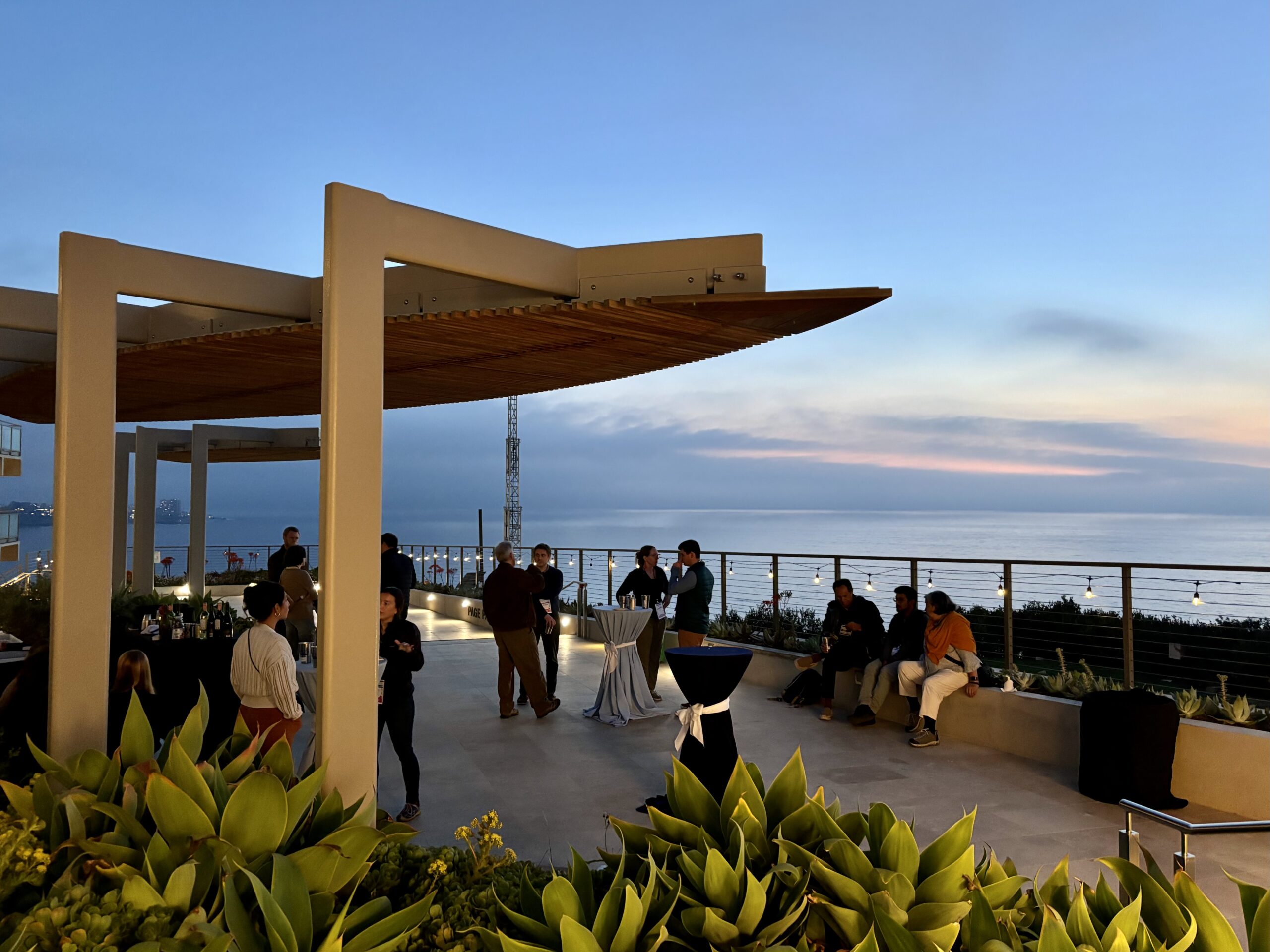 The sun sets over the Pacific Ocean during the Welcome event.